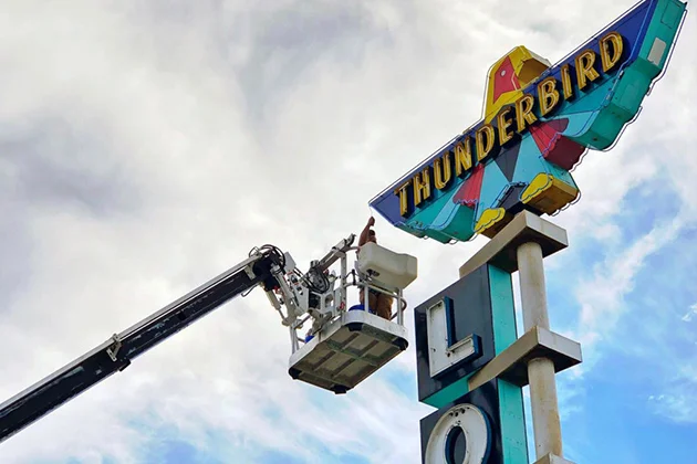 Neon Thunderbird sign undergoing sign maintenance